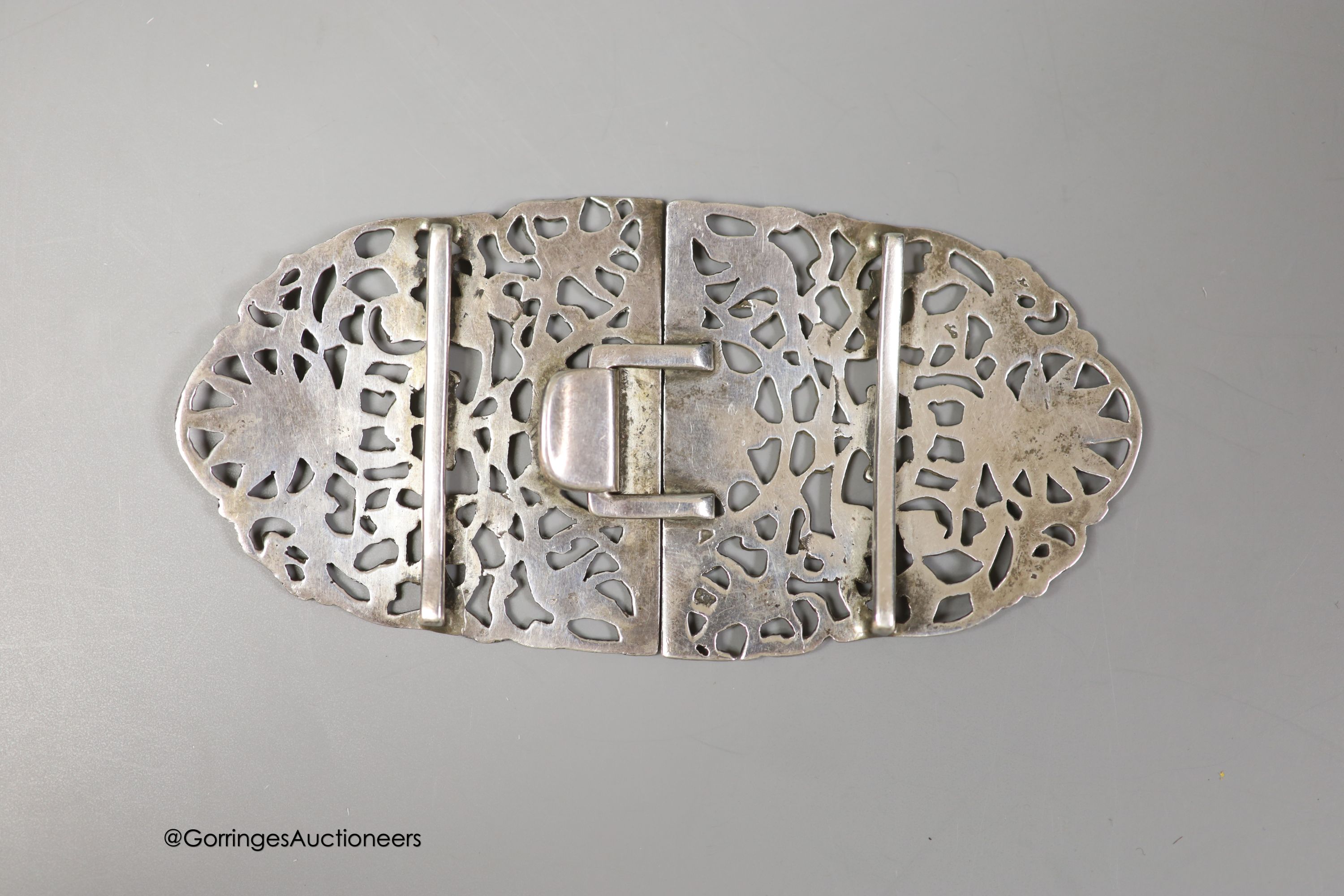 A late Victorian pierced silver oval nurses buckle, by Grey & Co, London, 1896, 13.2cm, 85 grams